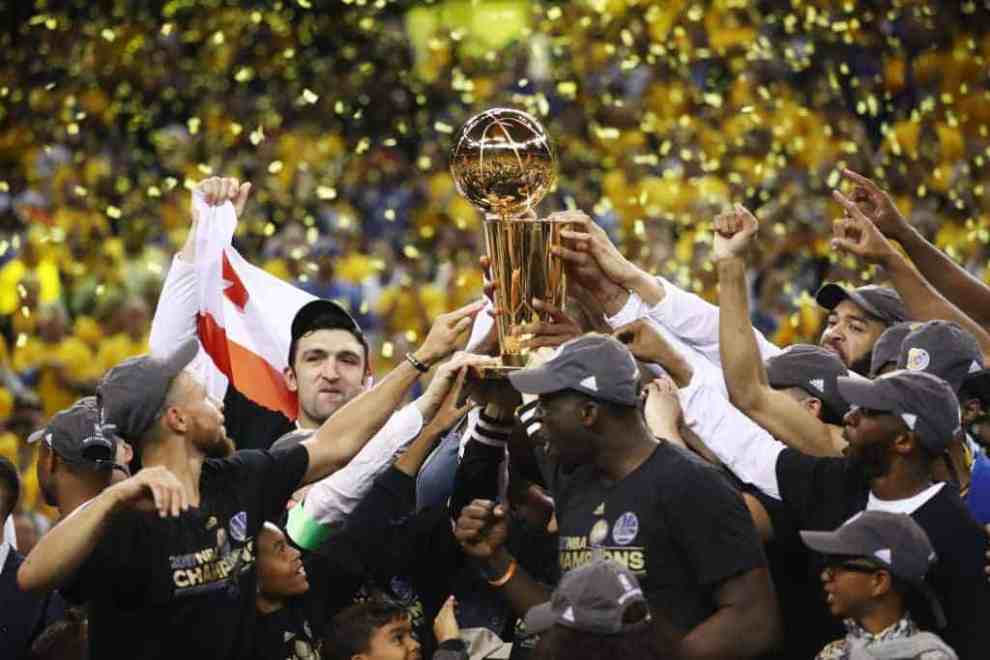 NBA Champions Golden State Warriors celebrating on court after win