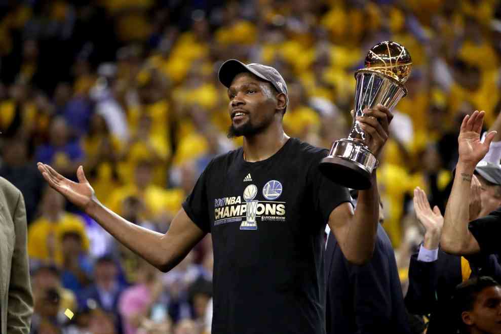 Kevin Durant holding the O'Brien trophy trophy after 2017 NBA Championship game