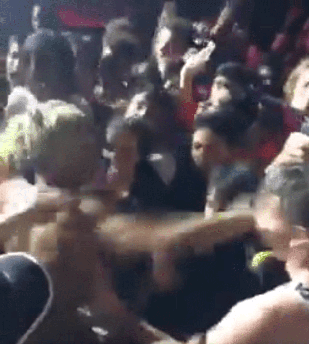 Screenshot from video of XXXtentacion punching fan during show