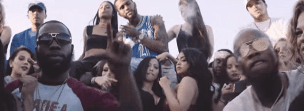 Screenshot from video of 'Loud Pack' showing Tory Lanez and Dave East surrounded by women