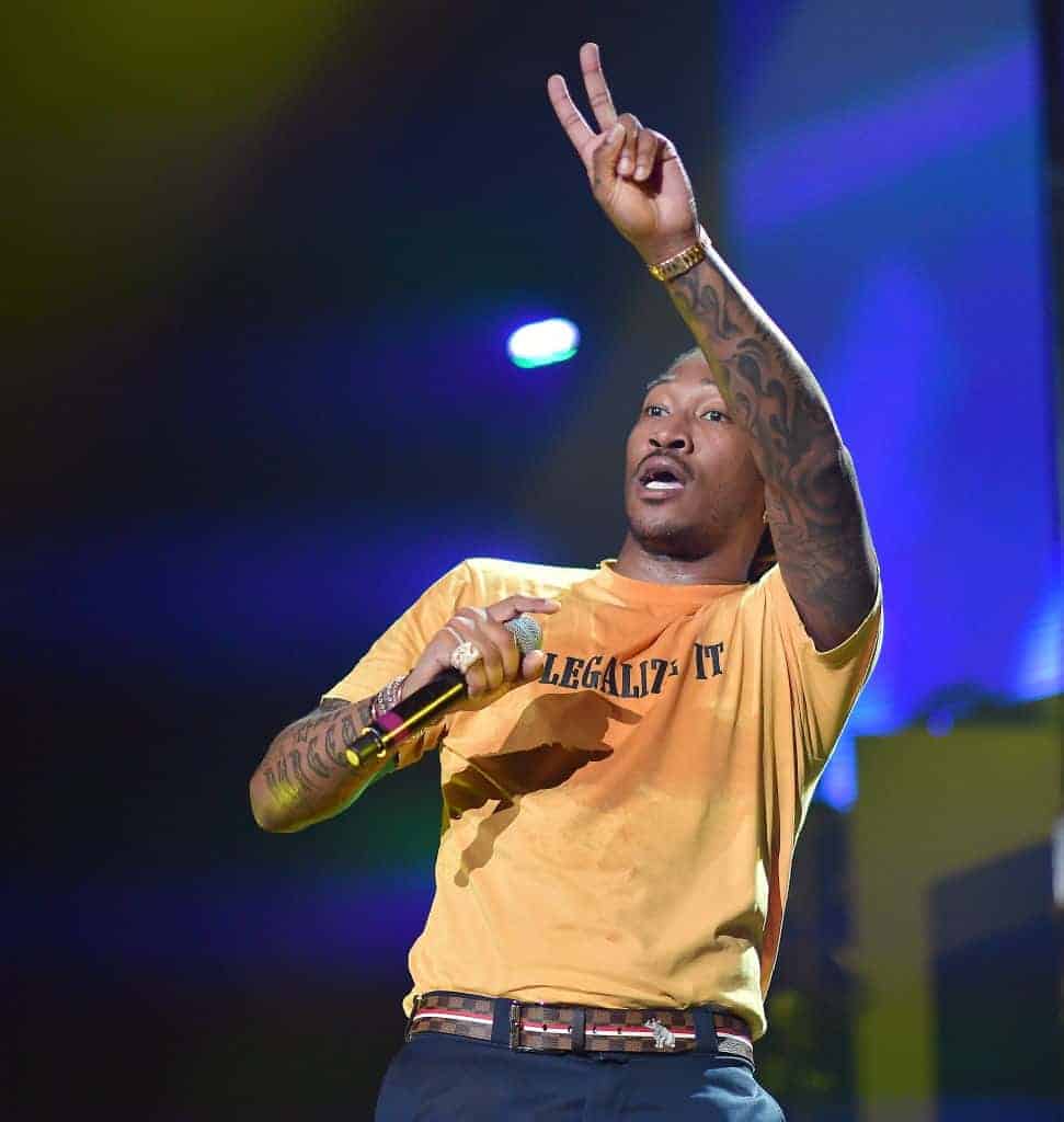 uture give the peace sign while performing