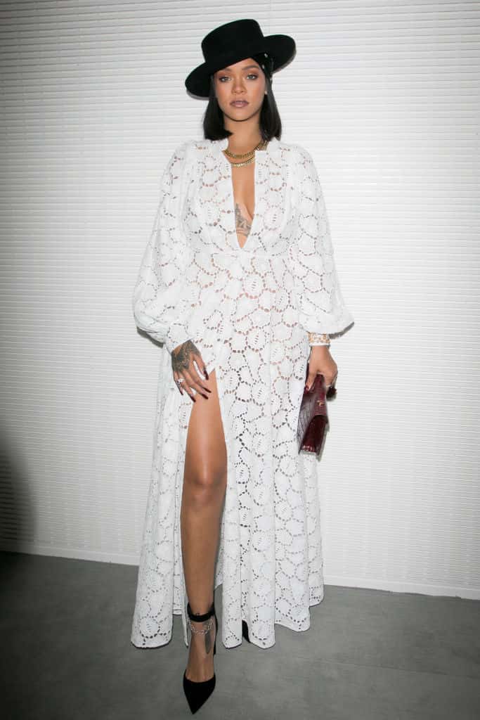 Rihanna wearing all white lace Dior dress and black hat at  LVMH Young Fashion Designer’s 2017 prize awards