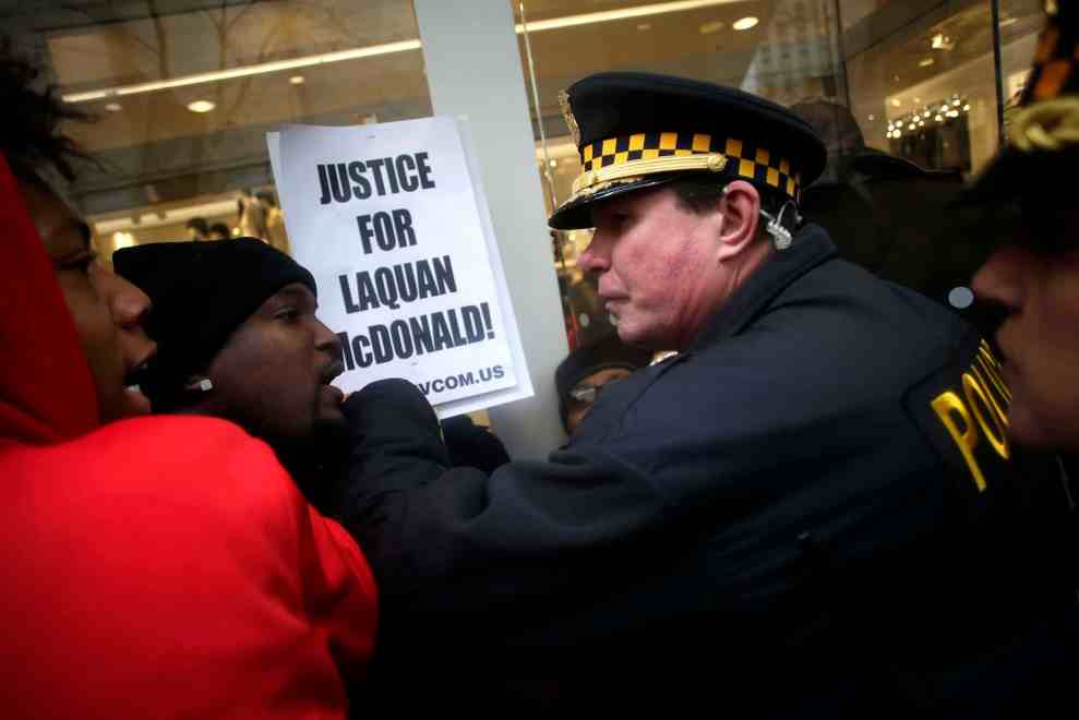 Police officer and protesters at Justice for Laquan McDonald protest