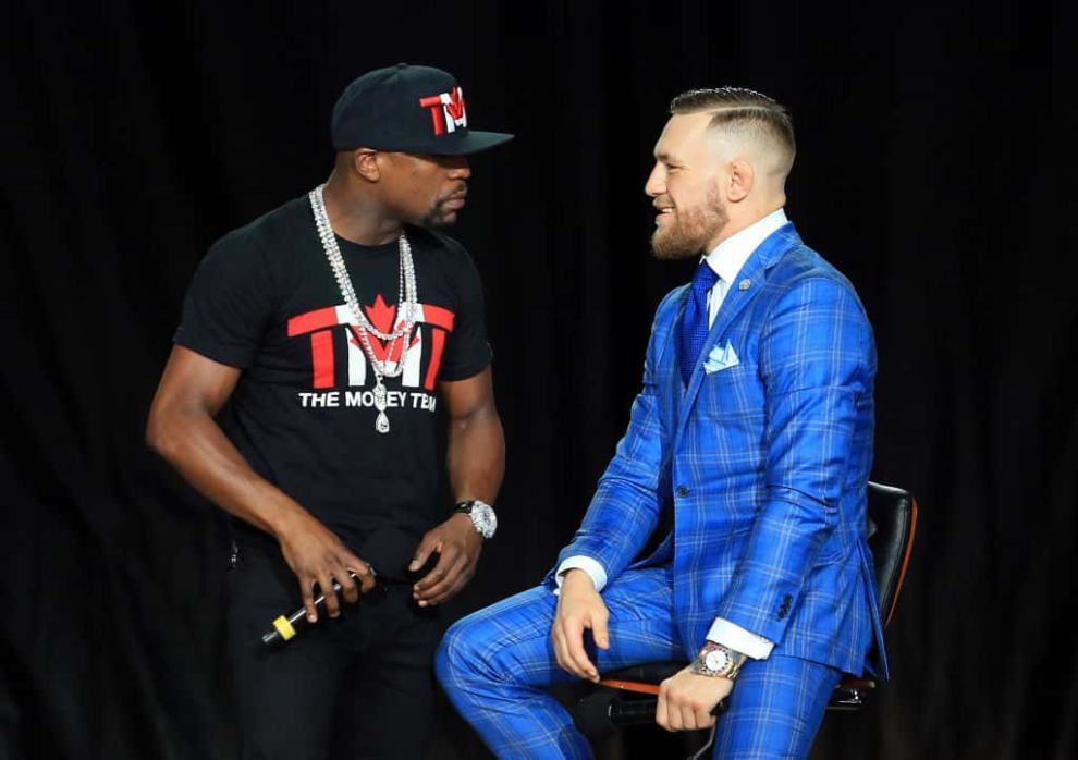 Floyd Mayweather speaks to Conor McGregor at World Press Tour at Budweiser Stage on July 12