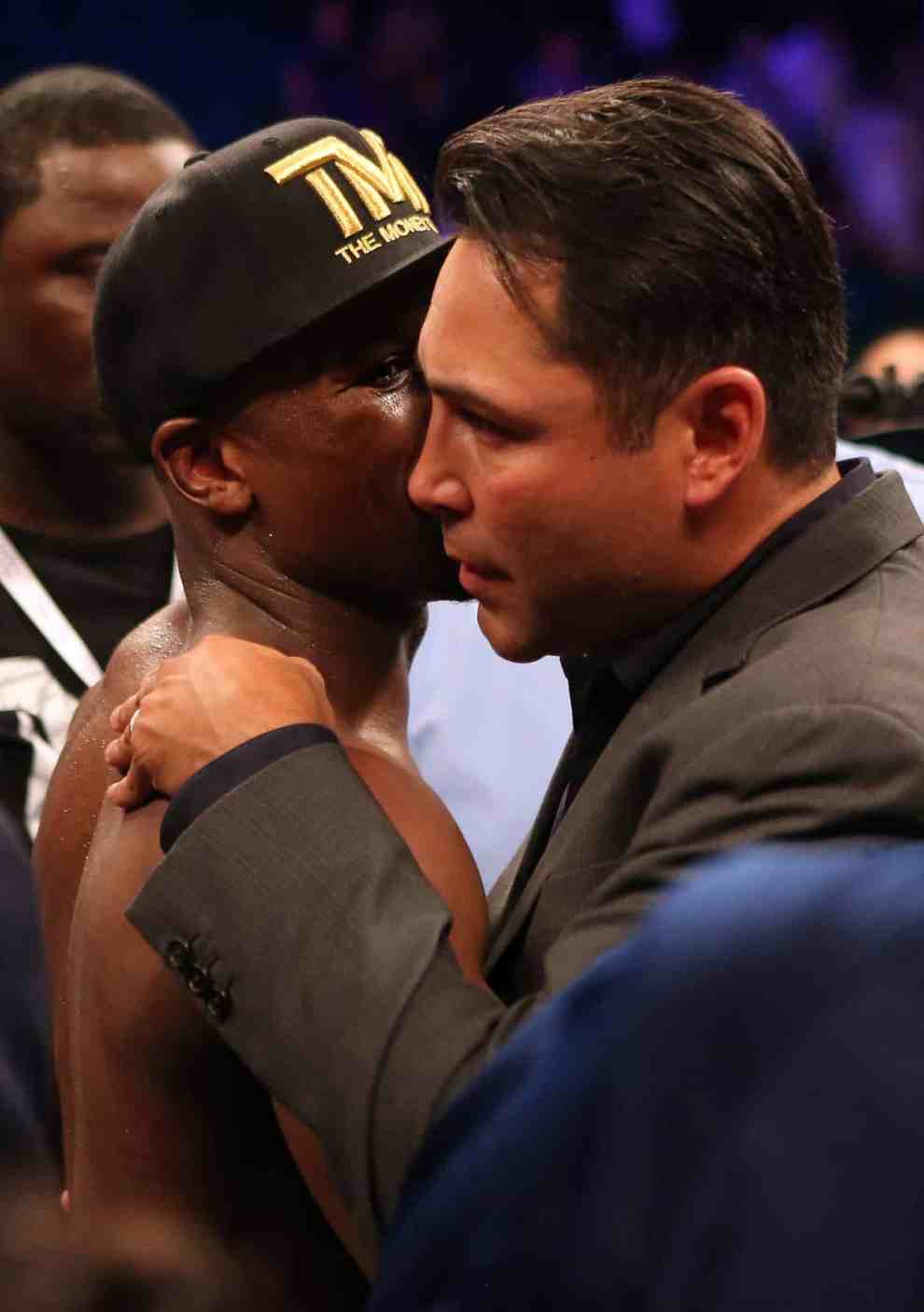 Floyd Mayweather Jr. speaks with Oscar De La Hoya after WBC welterweight title bout at MGM Grand Garden Arena on May 4