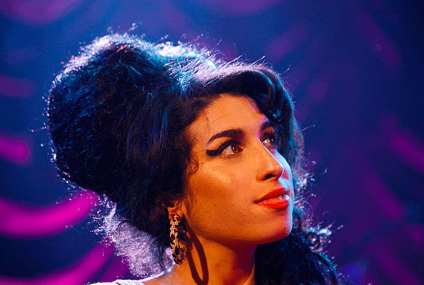 Amy Winehouse performing on stage