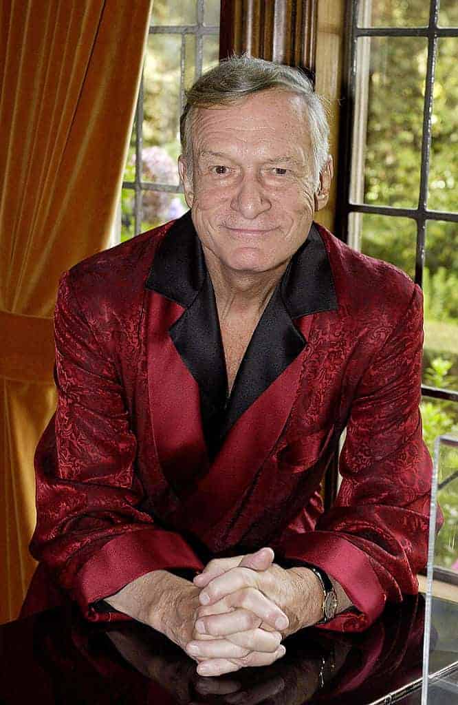 Playboy magazine founder Hugh Hefner poses at his Los Angeles