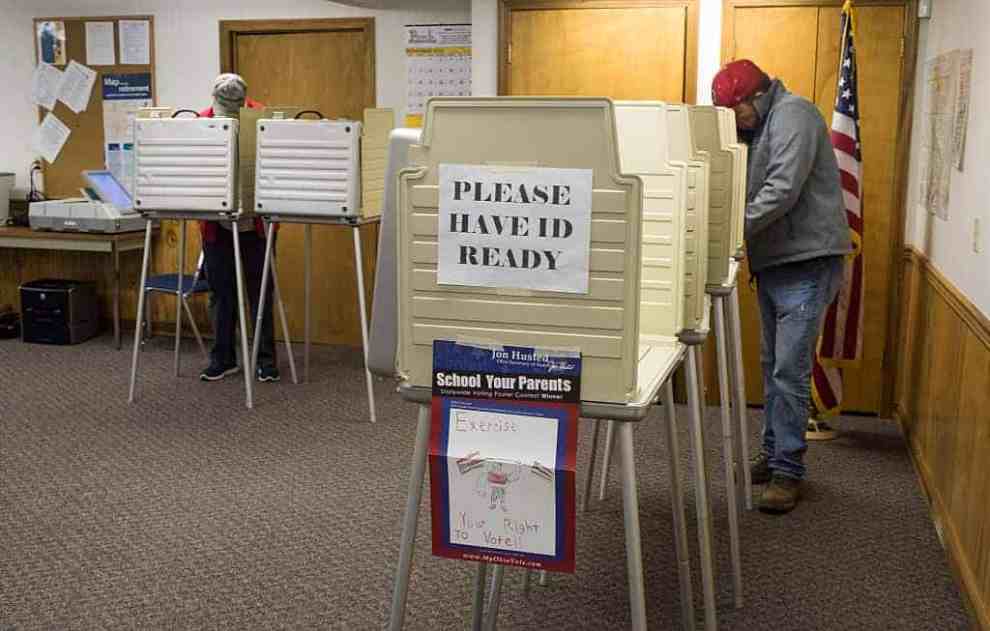 Voters cast their ballots at voting booths