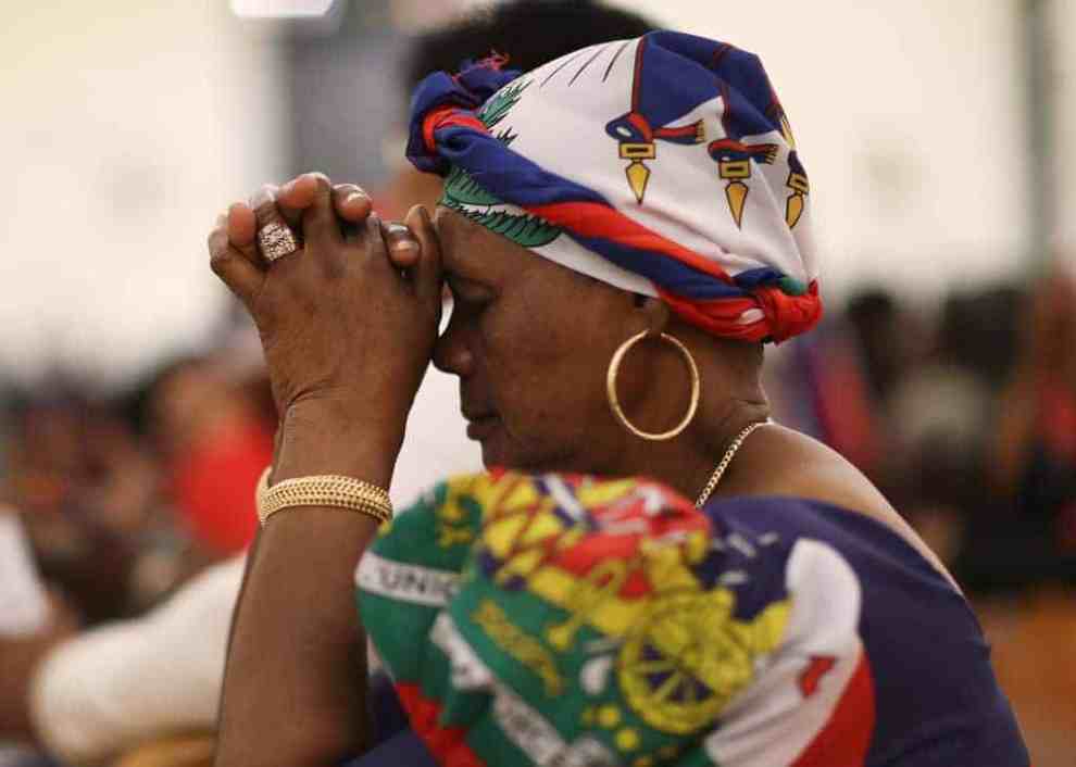 Haitian woman praying