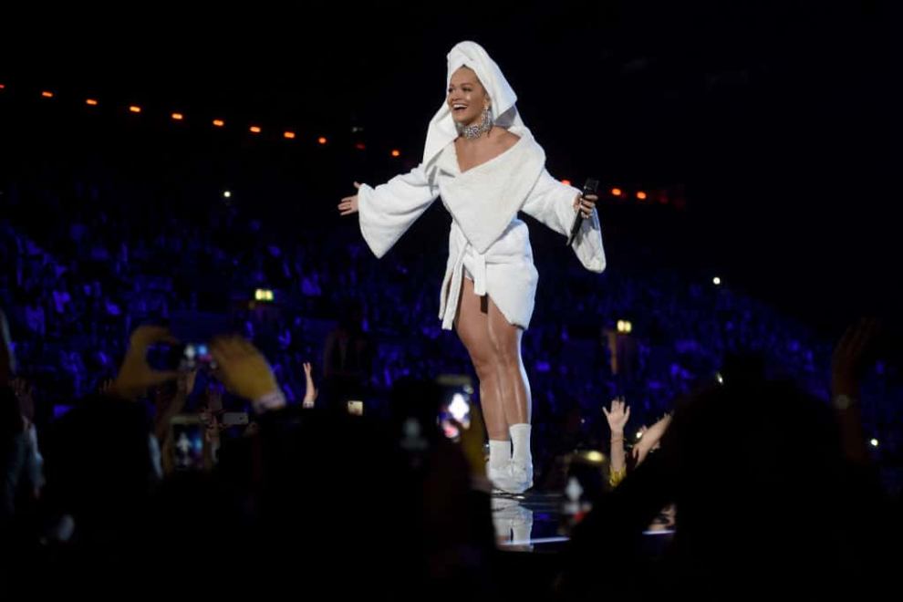 Rita Ora peaks on stage during the MTV EMAs 2017