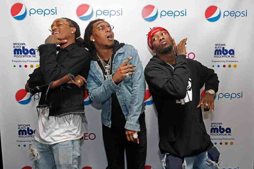 Migos posing on red carpet at National Black MBA Association Inc. Empowering Visionaries event co-sponsored with pepsif