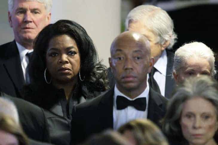 Oprah Winfrey and Russell Simmons attend the funeral of Eunice Kennedy Shriver at St. Xavier Church August 14