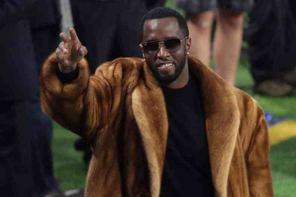 Sean 'Diddy' Combs waves to the crowd during warm-ups prior to Super Bowl LII