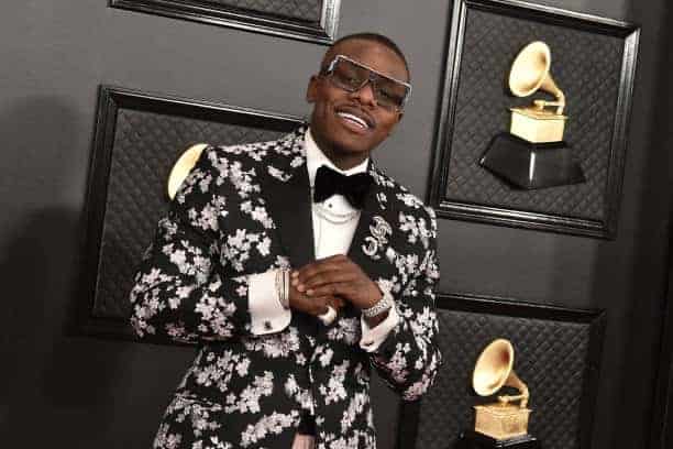 DaBaby wearing black and silver jacket