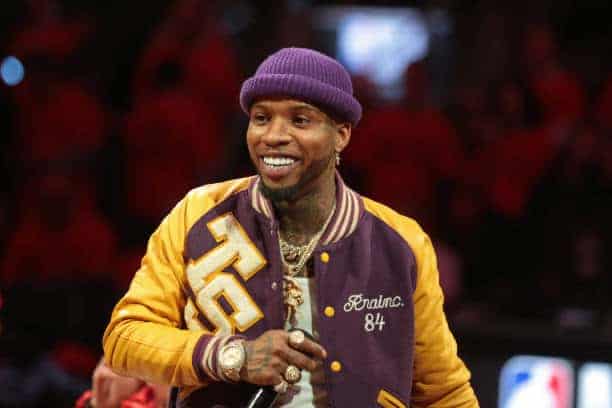 Tory Lanez wearing purple and yellow