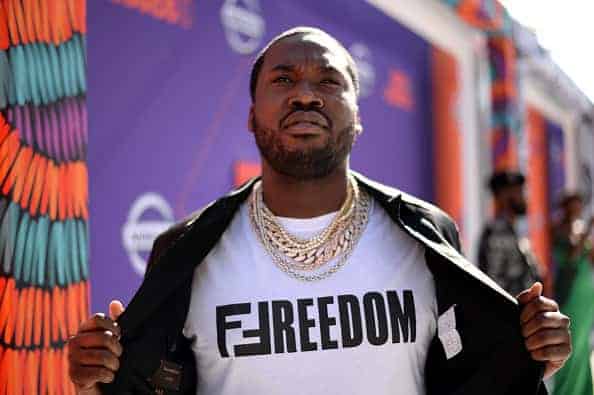Meek Mill wearing Freedom shirt and gold chains