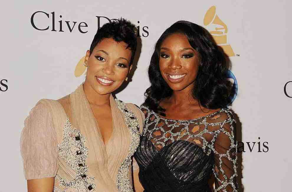 Monica and Brandy smiling at the camera