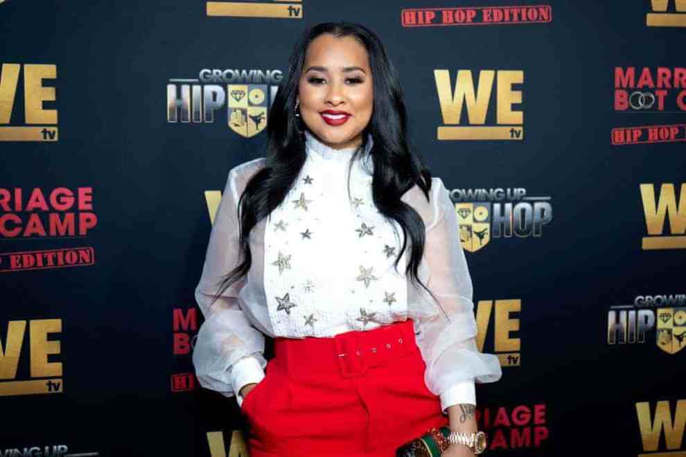 Tammy Rivera smiling at the camera wearing red and white
