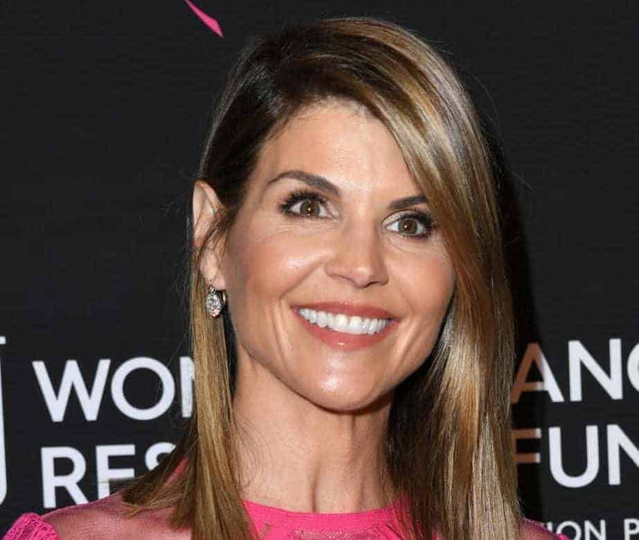 Lori Loughlin wearing pink and smiling
