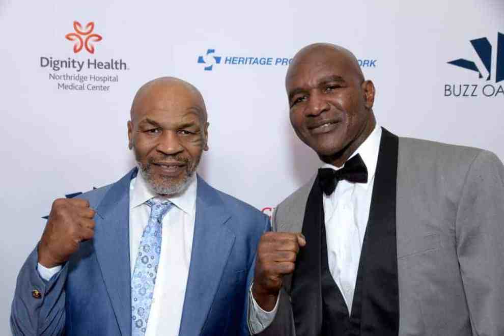 Mike Tyson and Evander Holyfield standing side by side