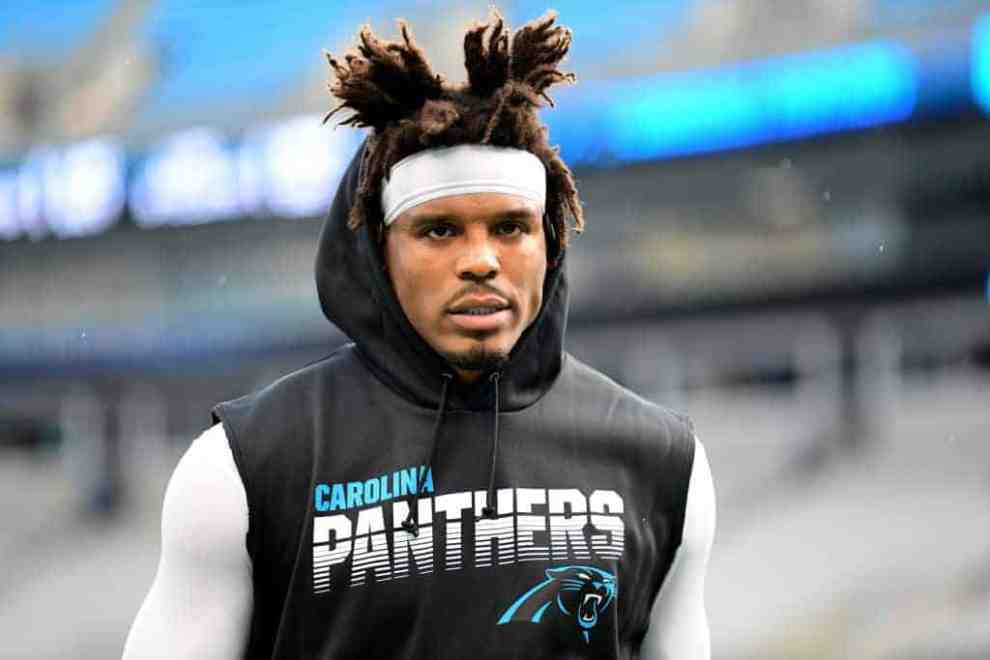 Cam Newton wearing his panthers warm up suit