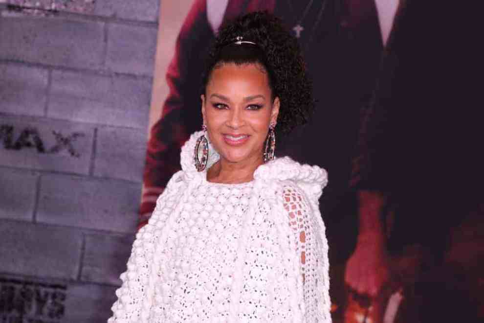 LisaRaye McCoy wearing white smiling at the camera