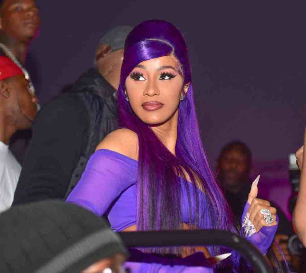 Cardi B. wearing purple