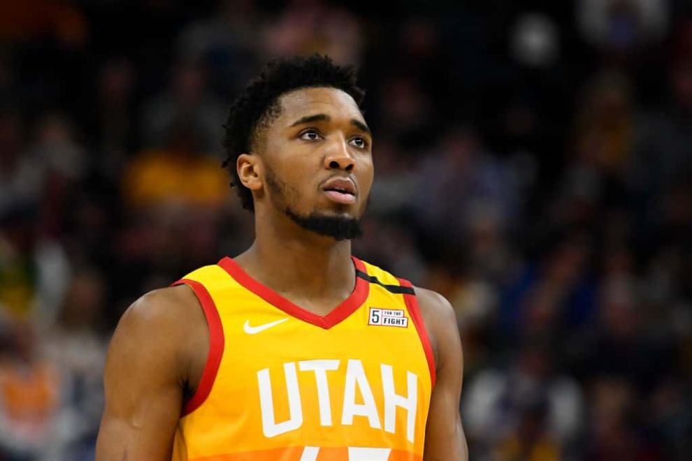 Donovan Mitchell wearing yellow and red jersey