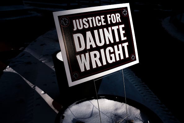 A sign reading Justice for Daunte Wright is placed outside the Hennepin County Government Center on December 23