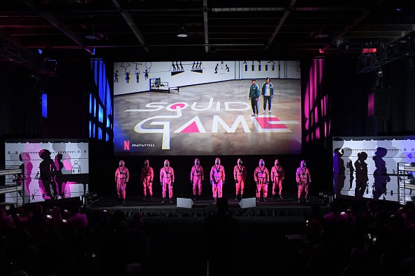 Squid Game guards appear onstage during Netflix's FYSEE event for "Squid Game" at Raleigh Studios Hollywood on June 12