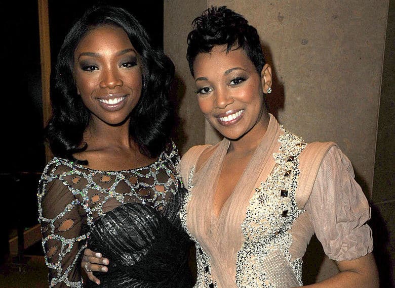 Singers Brandy (L) and Monica pose at the 2011 Pre-GRAMMY Gala and Salute To Industry Icons Honoring David Geffen at Beverly Hilton on February 12