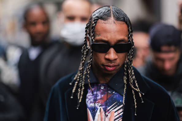 Tyga wearing black prada shades and a black jacket outside Lanvin on October 03