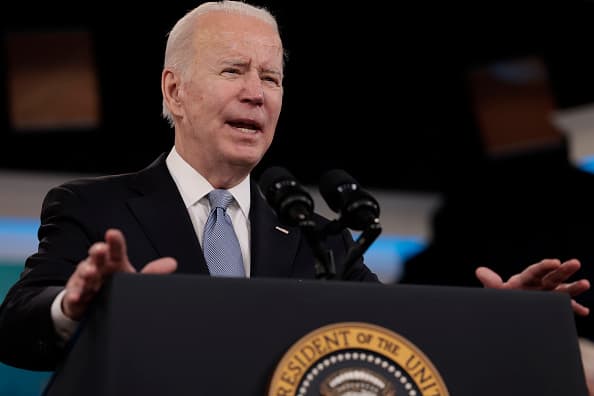 U.S. President Joe Biden delivers remarks on his administration's efforts to increase manufacturing alongside members of his cabinet and Congress