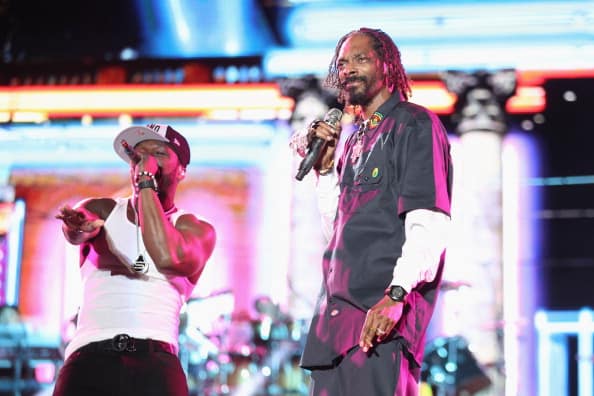 Rappers 50 Cent (L) and Snoop Dogg perform onstage during day 3 of the 2012 Coachella Valley Music & Arts Festival at the Empire Polo Field on April 15