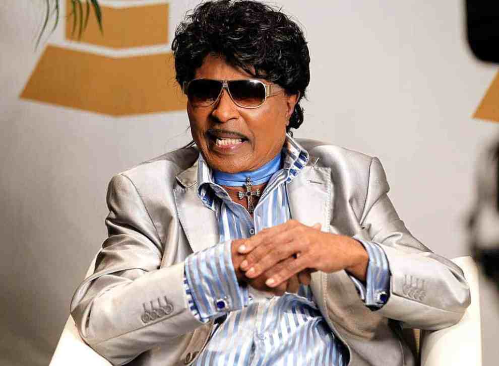 Little Richard on stage wearing glasses
