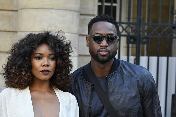 Gabrielle Union and Dwyane Wade during the Berluti Menswear Spring/Summer 2018 show as part of Paris Fashion Week on June 23