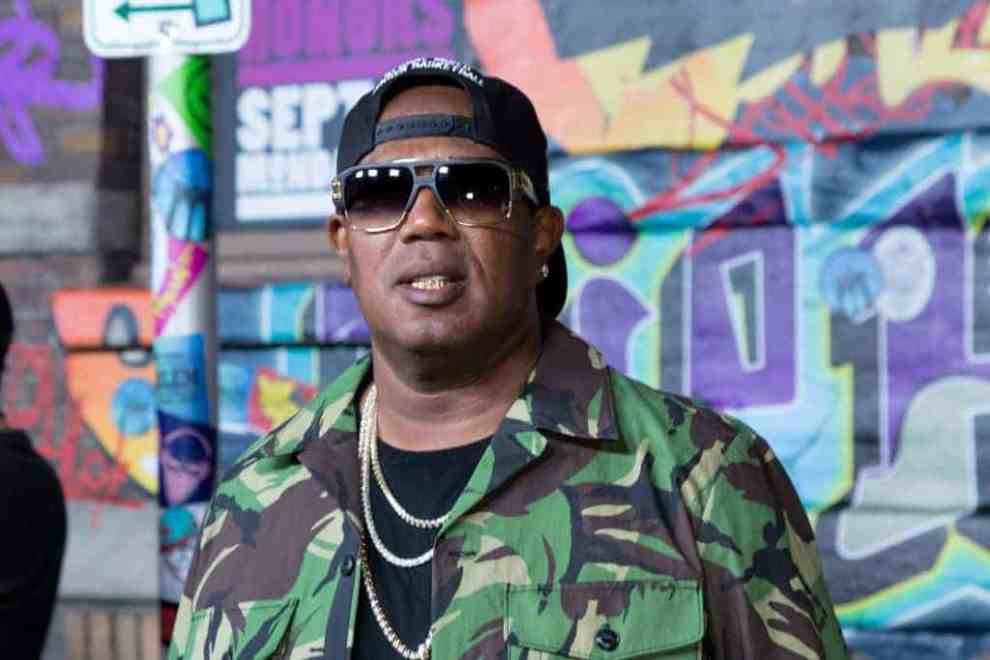 Master P. wearing green and sunglasses