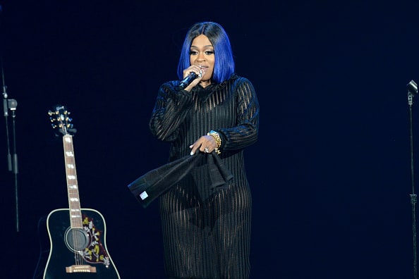 R&B singer Lil' Mo performs onstage during the Pain is Love tour at Microsoft Theater on September 30