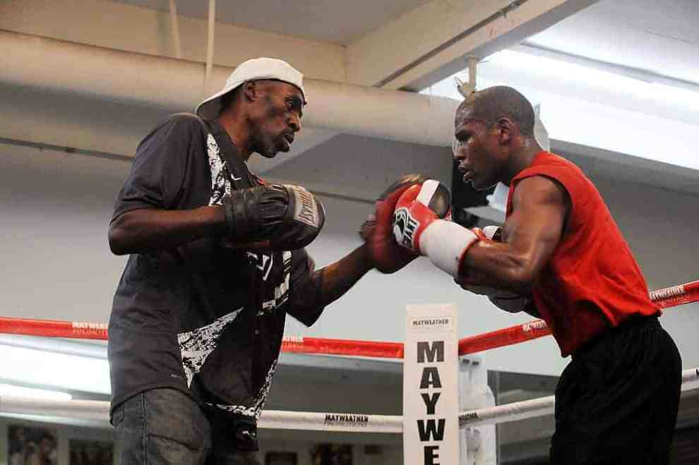 Roger Mayweather training Floyd Mayweather JR in the boxing ring