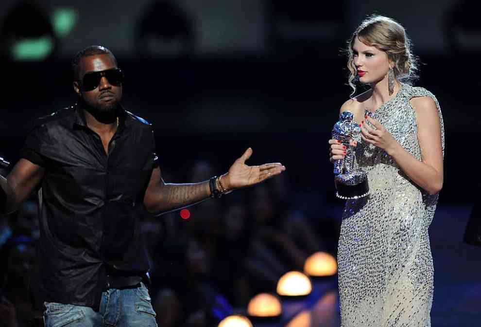NEW YORK - SEPTEMBER 13: Kanye West takes the microphone from Taylor Swift and speaks onstage during the 2009 MTV Video Music Awards at Radio City Music Hall on September 13