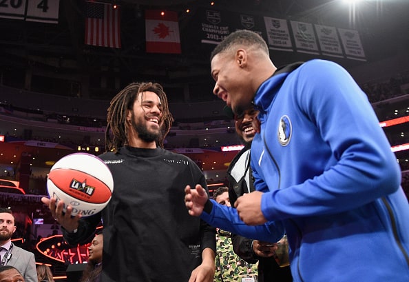 J. Cole and Dennis Smith Jr. attend the 2018 Verizon Slam Dunk Contest at Staples Center on February 17