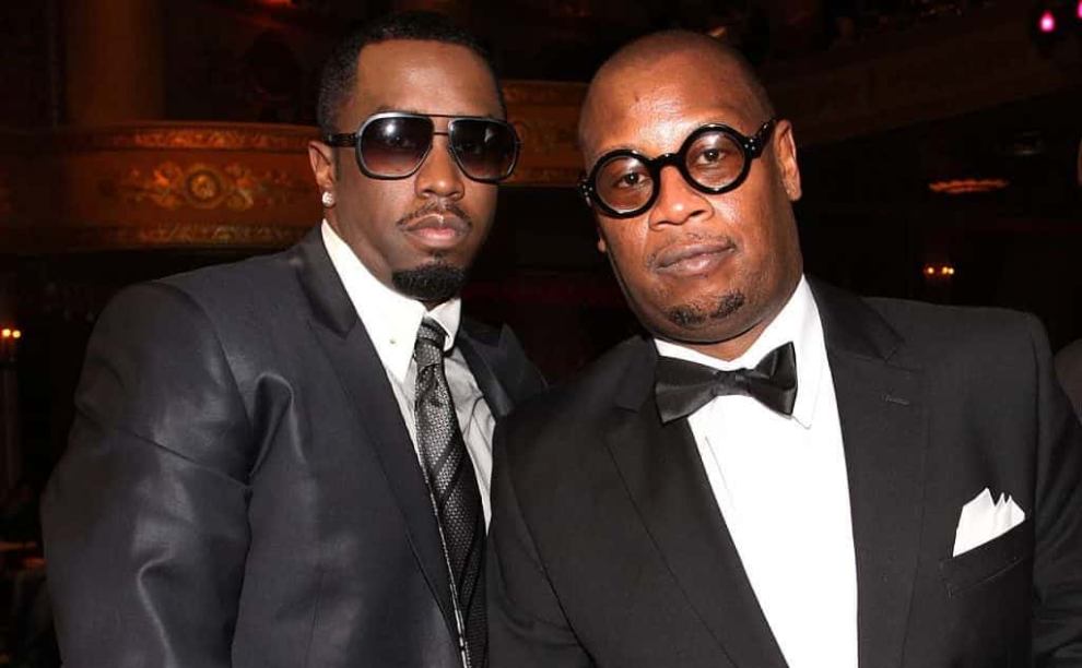 Diddy and Andre Harrell standing next to each other