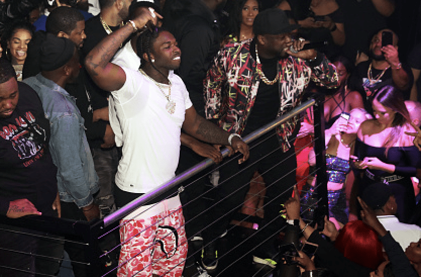 Pop Smoke (c) and 50 Cent (r) appear onstage at Trey Songz & 50 Cent Host The Big Game Weekend 2020 at Cameo on February 01