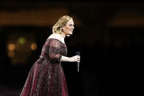 Adele singing at a concert