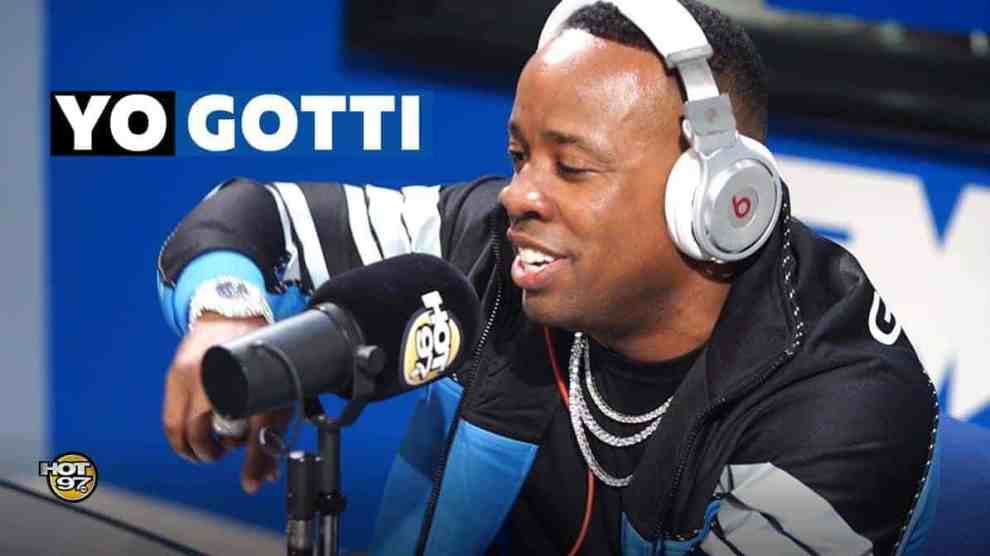 American Rapper You Gotti wearing beats headphones at the microphone