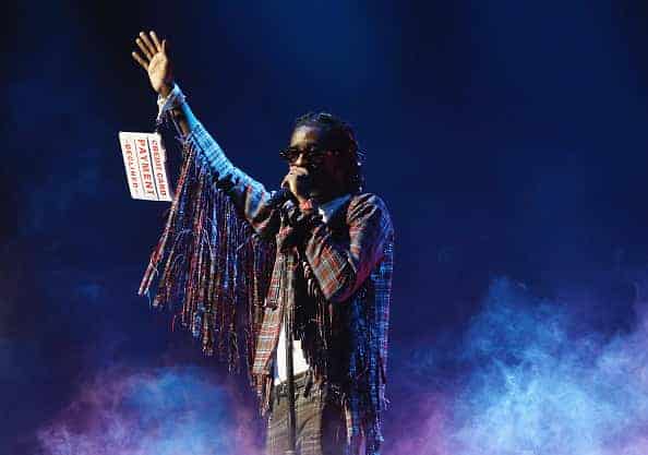 Young Thug performing on stage.