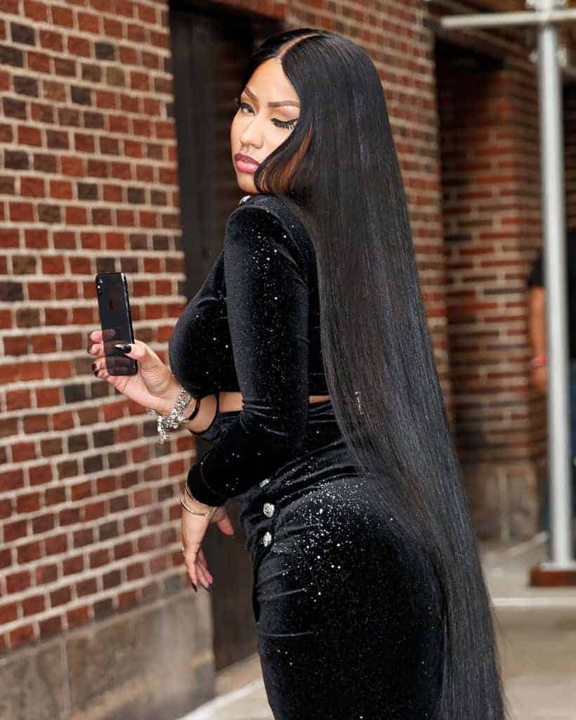 Nicki Minaj in black velvet dress taking selfie