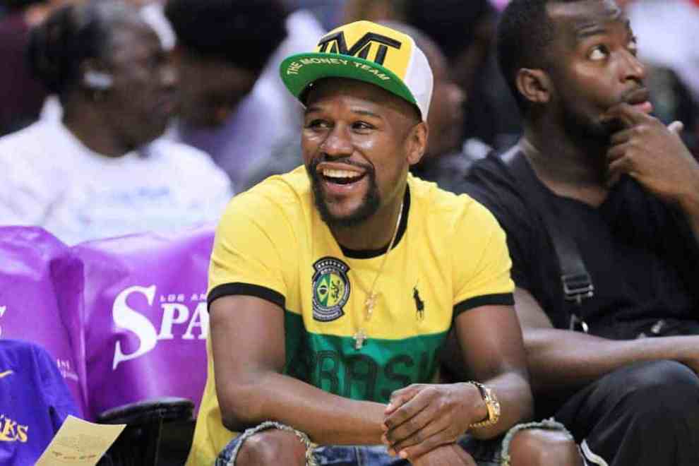 Boxer Floyd Mayweahther at the New York Liberty v Los Angeles Sparks game sitting court side.