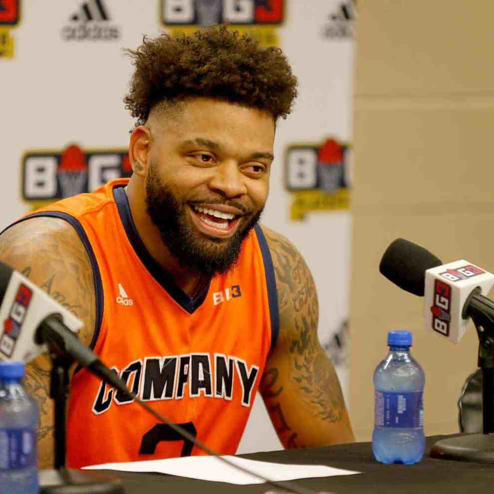 Andre Emmett wearing an orange jersey