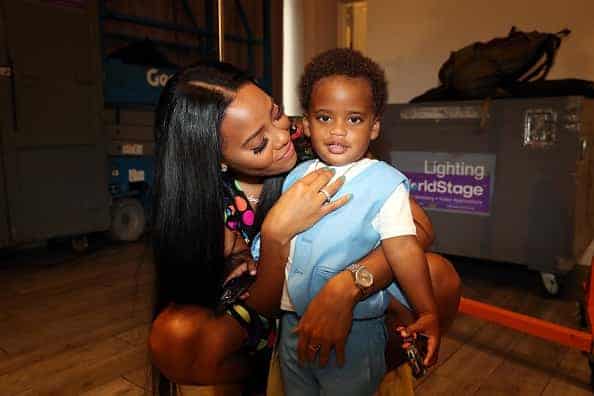 Angela Simmons poses with her son Sutton Joseph Tennyson at the Bonnie Bouche By Angela Simmons - Style360 - New York Fashion We